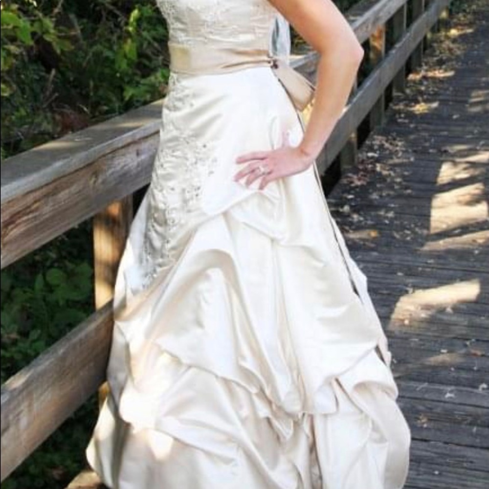 Oleg Cassini strapless wedding gown. Champagne color with latte colored ribbon.